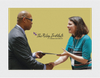 Image of Juan Johnson, Facilitator for Diversity Leaders Initiative, handing graduation certificate to participant.